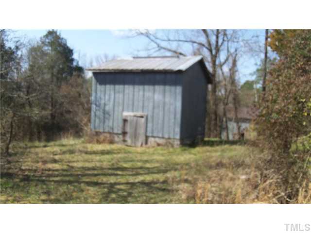 2066 Hester Road Creedmoor, NC 27522 - Photo 19 of 22 One of the three tobacco barns on this property.