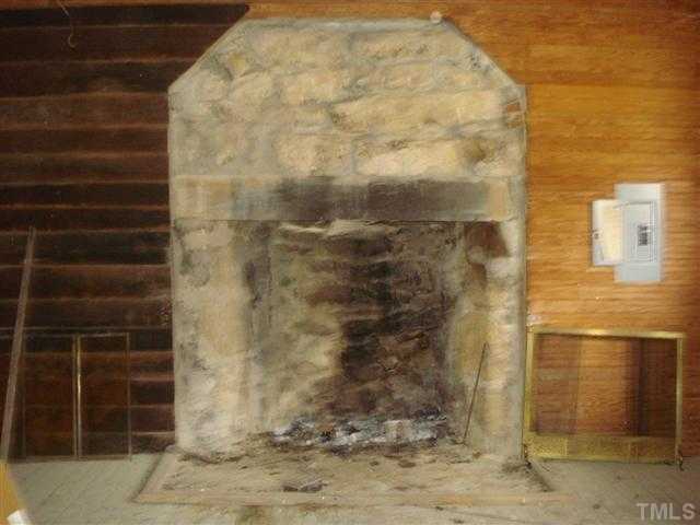 2066 Hester Road Creedmoor, NC 27522 - Photo 7 of 22 Huge stone fire pit inside the former kitchen house.