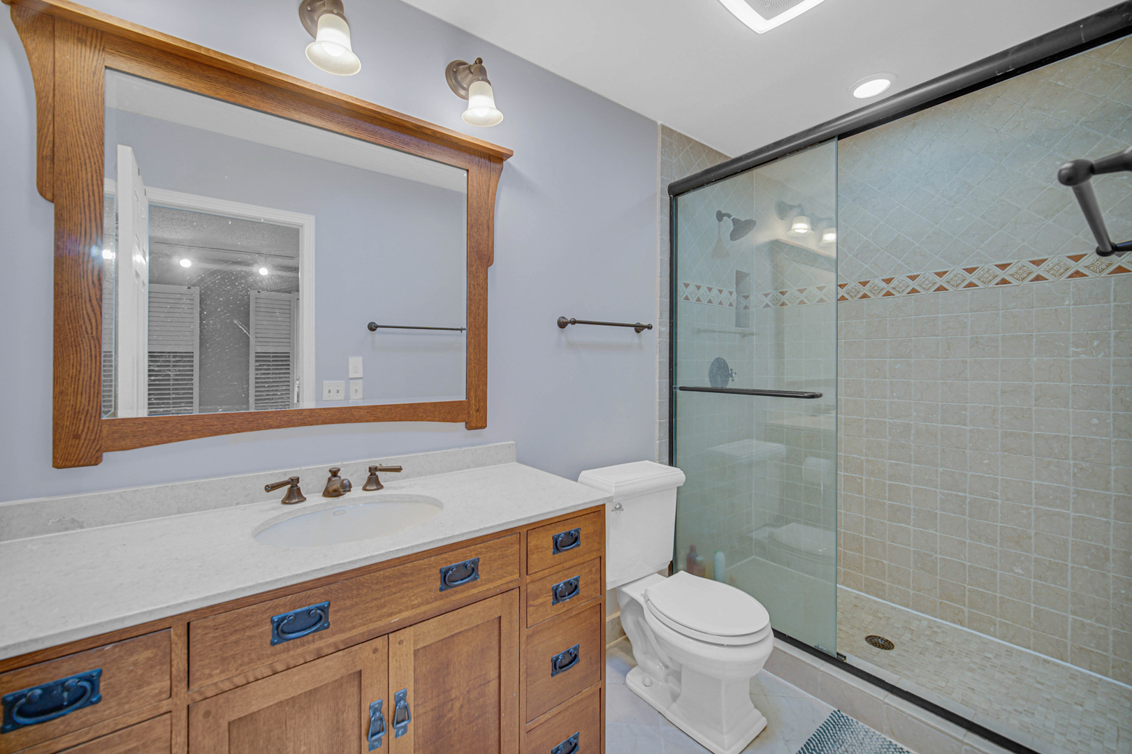 933 Shambliss Lane Buffalo Grove, IL 60089 - Photo 25 of 29 a bathroom with a sink toilet and shower