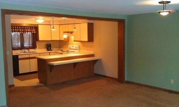 111 Brickyard Road, Unit 3G Athol, MA 01331 - Photo 12 of 16 a kitchen with a stove a sink and a refrigerator