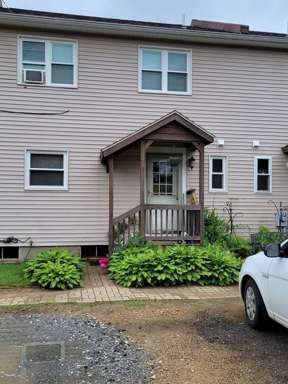 111 Brickyard Road, Unit 3G Athol, MA 01331 - Photo 4 of 16 a view of a house with a yard and potted plants