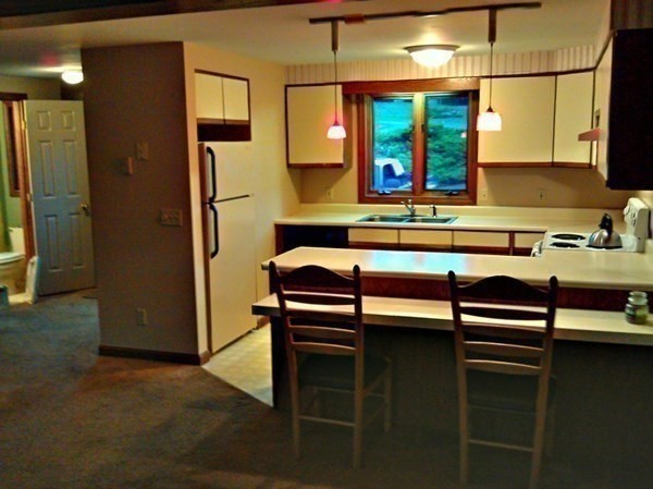 111 Brickyard Road, Unit 3G Athol, MA 01331 - Photo 10 of 16 a kitchen with stainless steel appliances granite countertop a sink and a refrigerator
