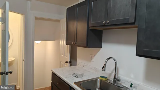 a white refrigerator freezer and a blue shower