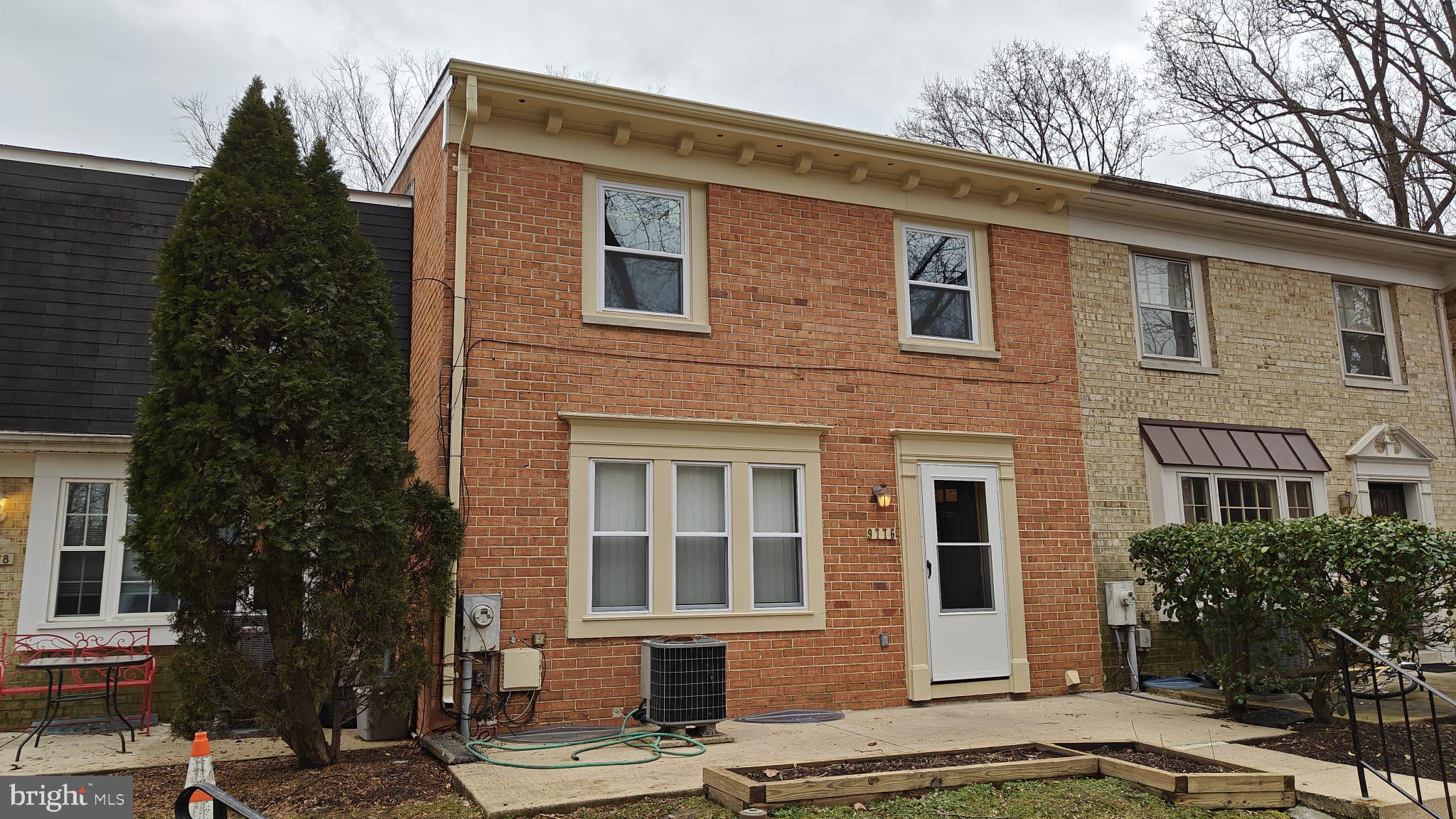 9776 Whiskey Run Laurel, MD 20723 - Photo 2 of 23 a front view of a house with a yard