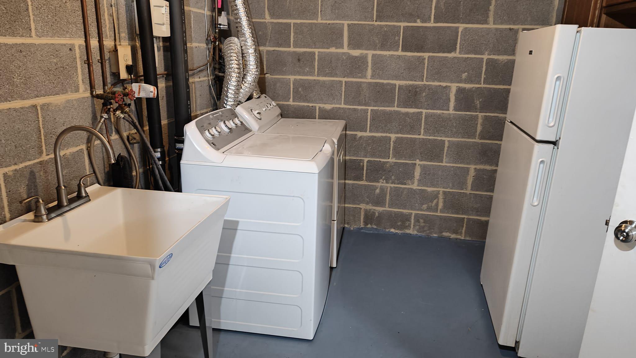9776 Whiskey Run Laurel, MD 20723 - Photo 22 of 23 a bathroom with a sink a toilet and shower