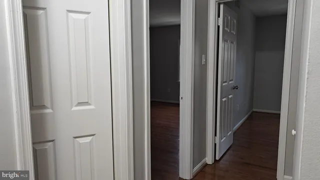 a view of a bathroom from a hallway