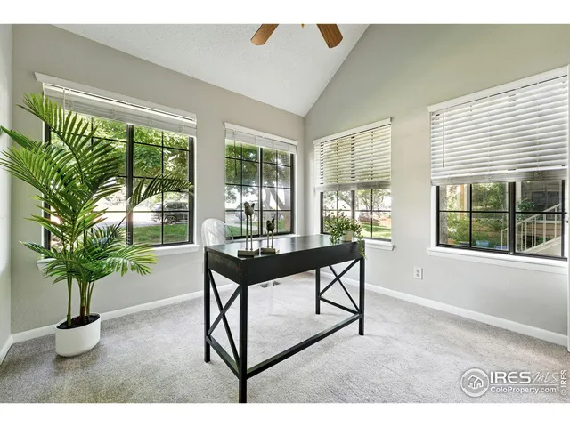 a view of a room with furniture and a potted plant