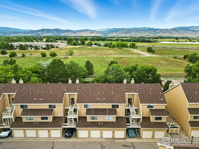 an aerial view of a house with a lake view