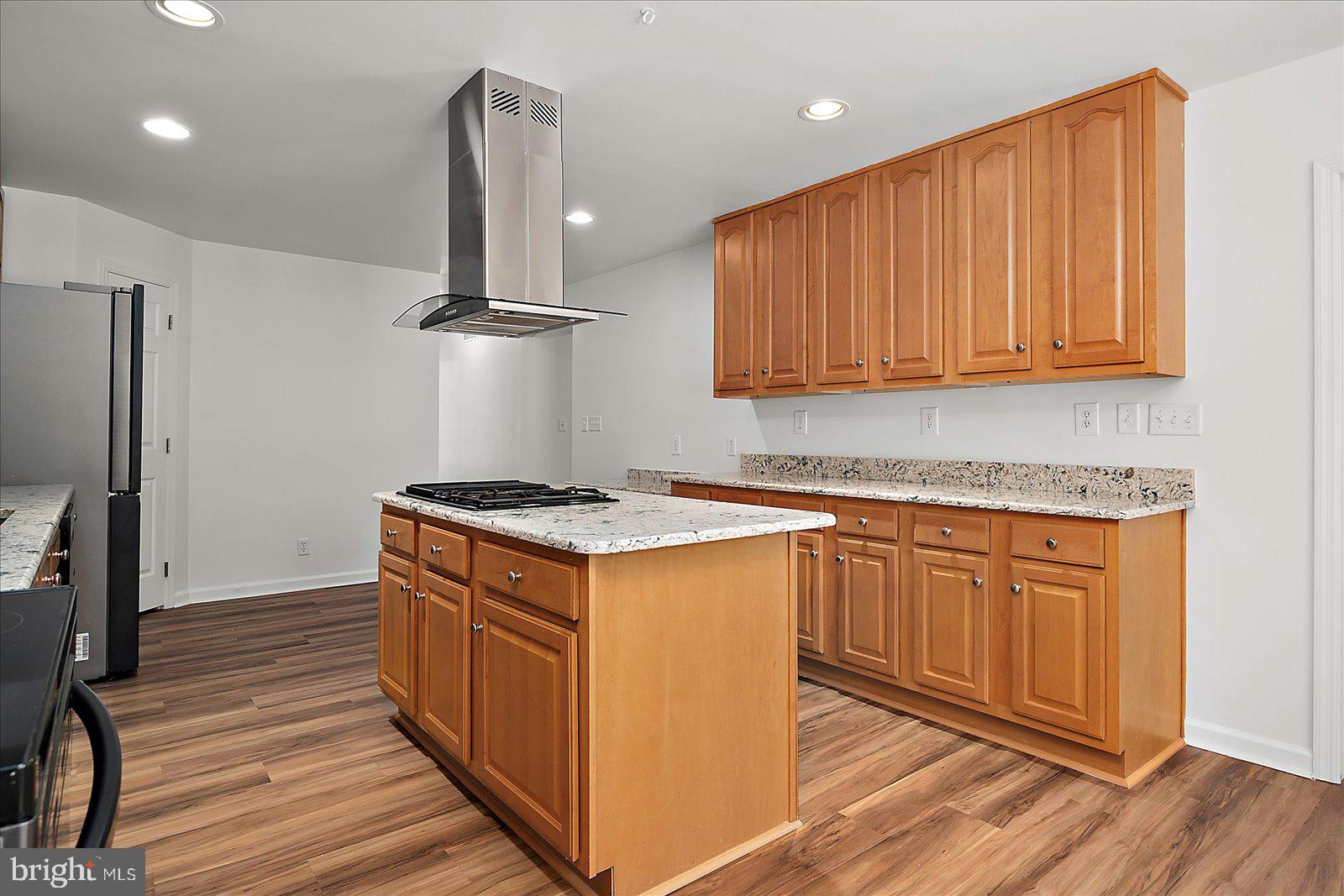 12212 Brant Road Bishopville, MD 21813 - Photo 25 of 69 a kitchen with stainless steel appliances granite countertop a stove a sink and a refrigerator