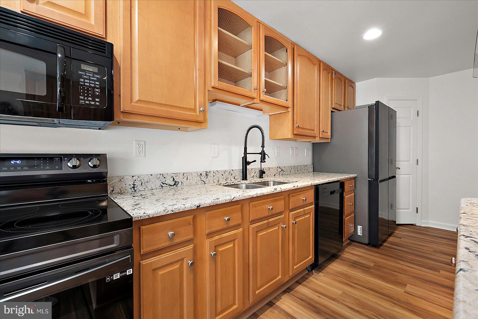 12212 Brant Road Bishopville, MD 21813 - Photo 26 of 69 a kitchen with stainless steel appliances granite countertop a refrigerator and a stove top oven