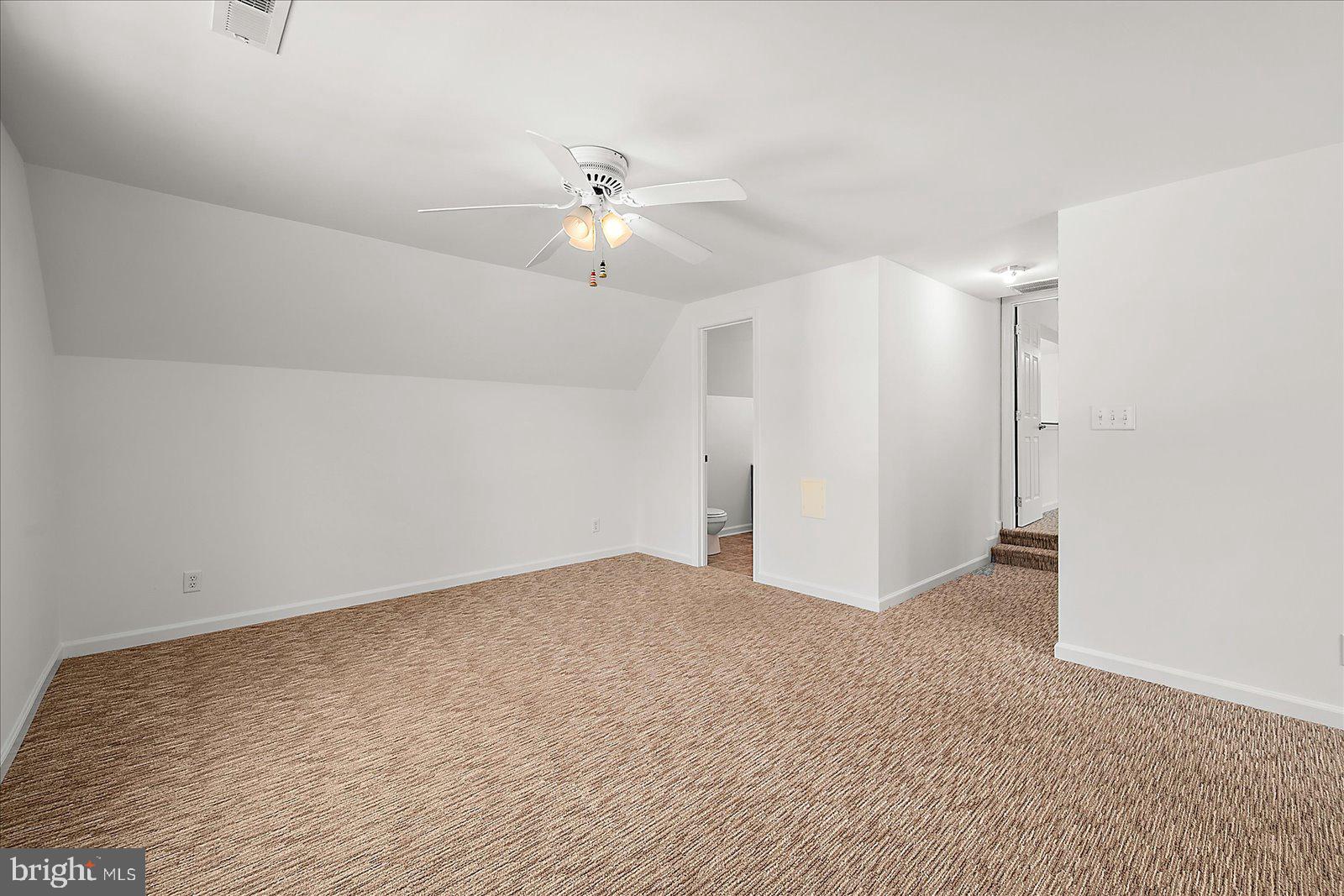 12212 Brant Road Bishopville, MD 21813 - Photo 40 of 69 an empty room with a ceiling fan and a window