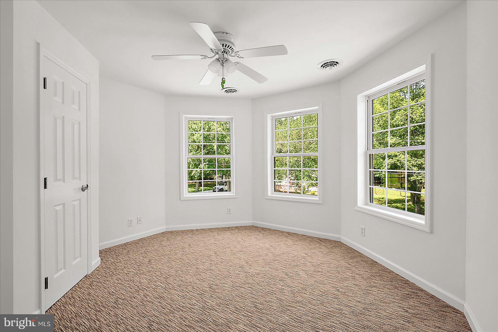 12212 Brant Road Bishopville, MD 21813 - Photo 46 of 69 a view of empty room with wooden floor and fan