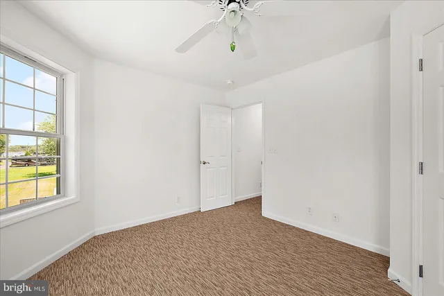 a view of outdoor space with deck and a garden