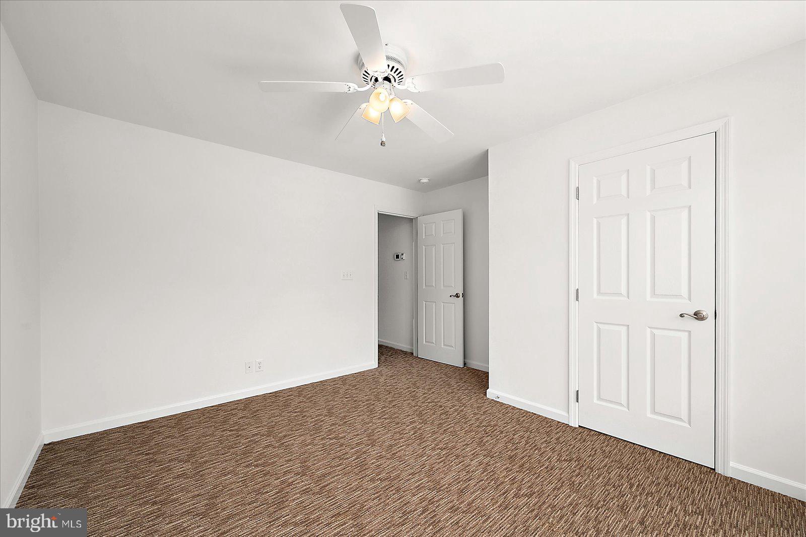 12212 Brant Road Bishopville, MD 21813 - Photo 50 of 69 a view of an empty room with a ceiling fan