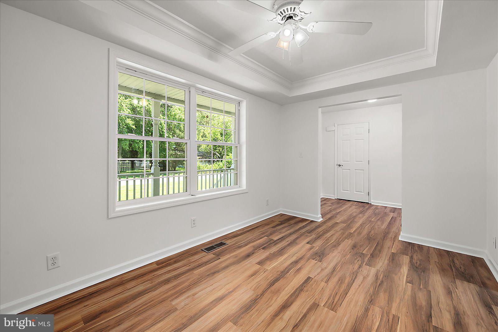 12212 Brant Road Bishopville, MD 21813 - Photo 7 of 69 wooden floor in an empty room with a window
