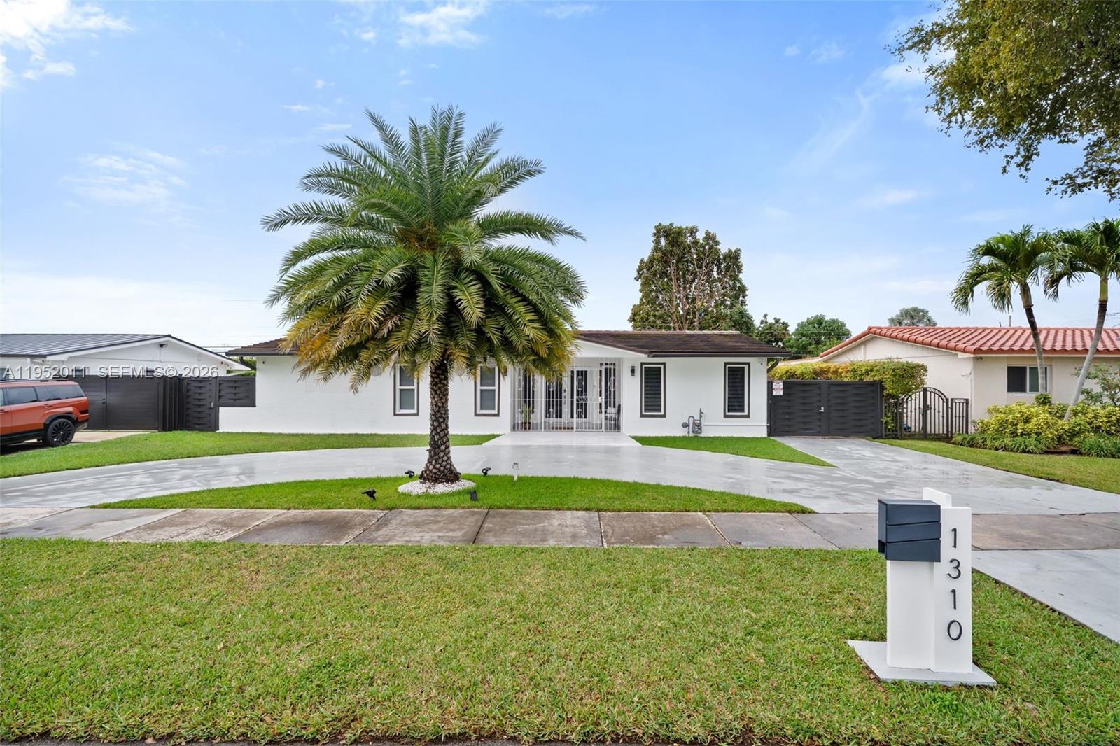a house with swimming pool in front of it