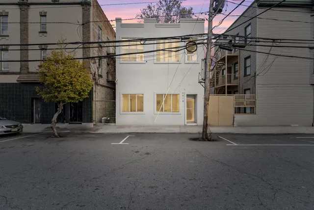 a view of a house with a street