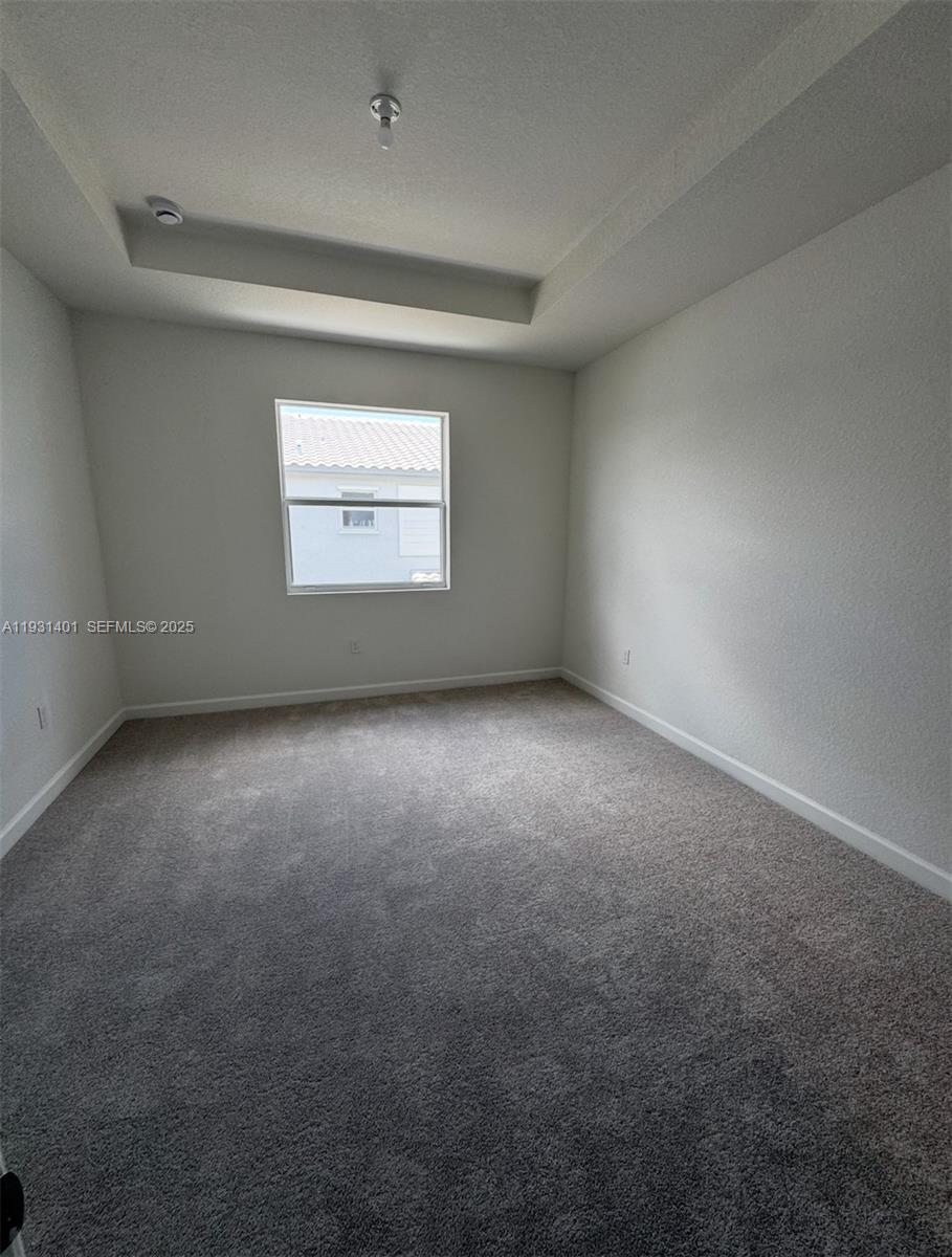 112 Southwest 184th Way, Unit 112 Pembroke Pines, FL 33029 - Photo 14 of 18 an empty room with a window