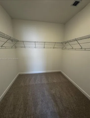 a view of a room with racks on the wall