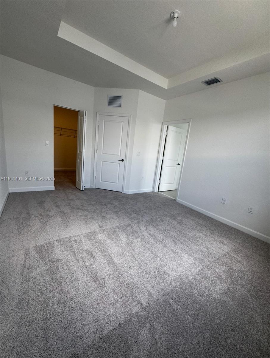 112 Southwest 184th Way, Unit 112 Pembroke Pines, FL 33029 - Photo 16 of 18 a view of an empty room and a window