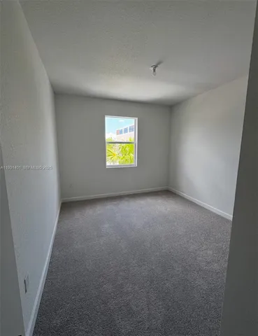 a view of an empty room with window