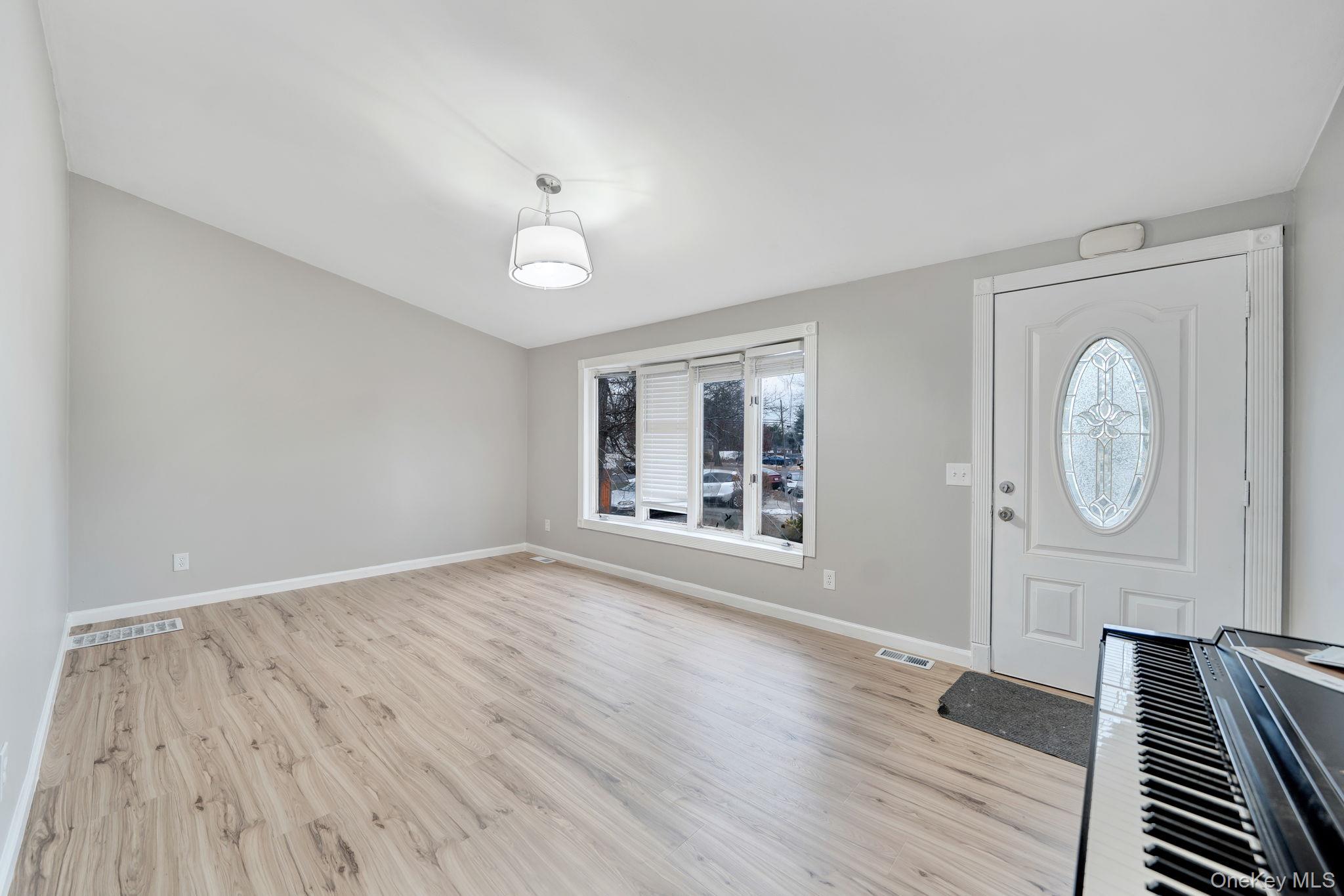 7 Kristin Court Bay Shore, NY 11706 - Photo 5 of 14 Entryway featuring light wood finished floors and baseboards