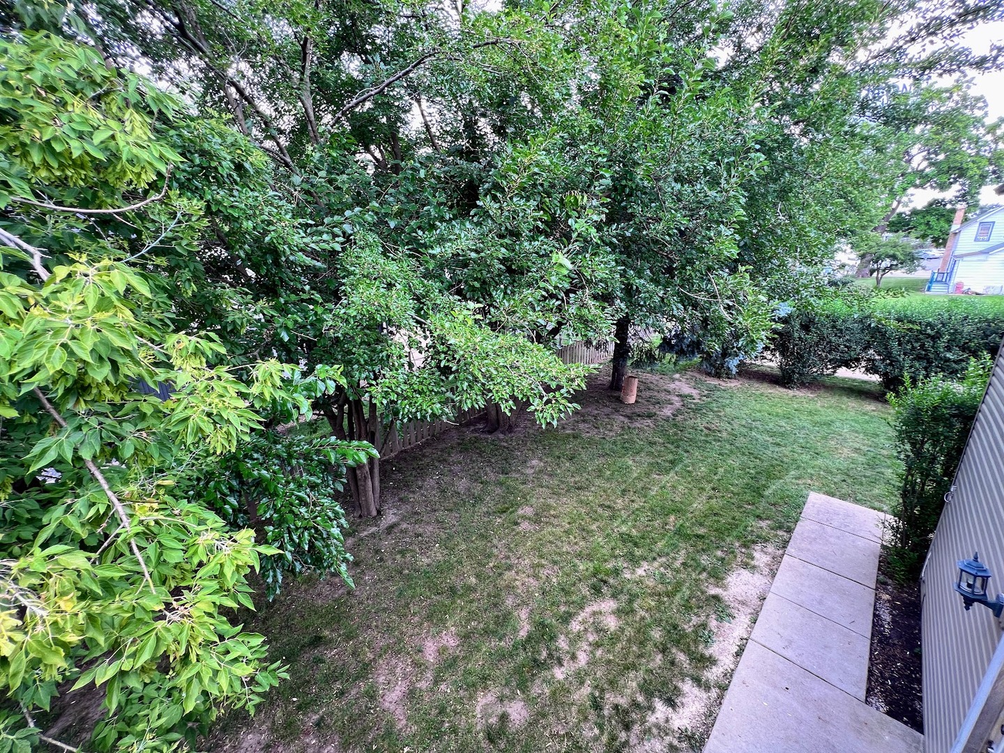 218 South Church Street, Unit 4 Wauconda, IL 60084 - Photo 11 of 11 a view of a garden with a bench