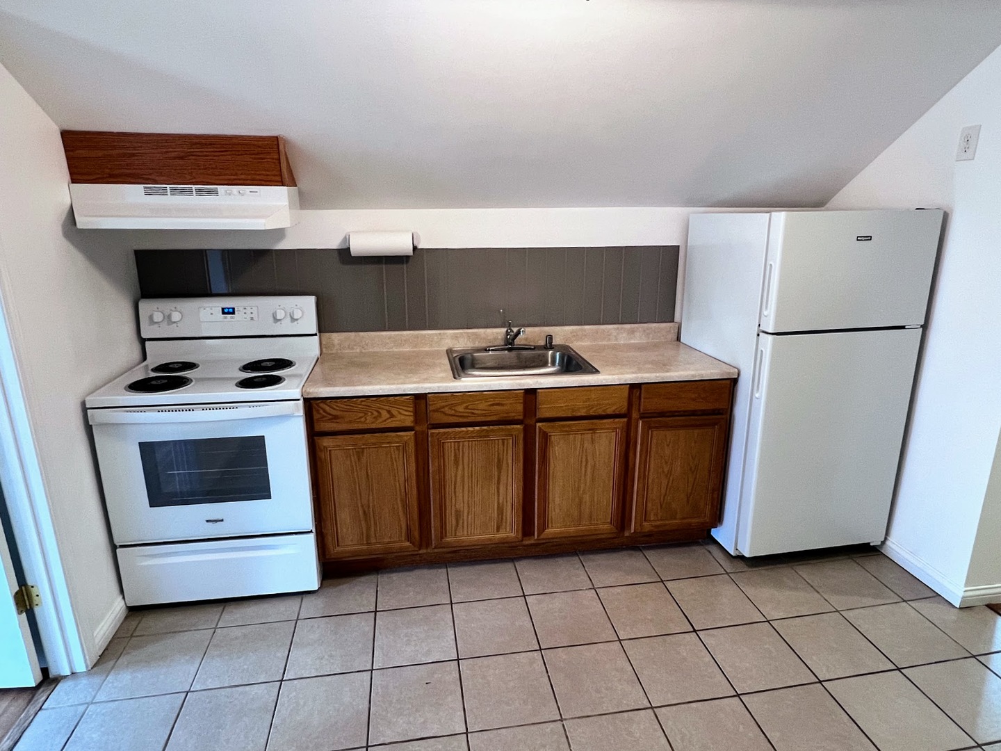 218 South Church Street, Unit 4 Wauconda, IL 60084 - Photo 2 of 11 a utility room with dryer washer and a fridge