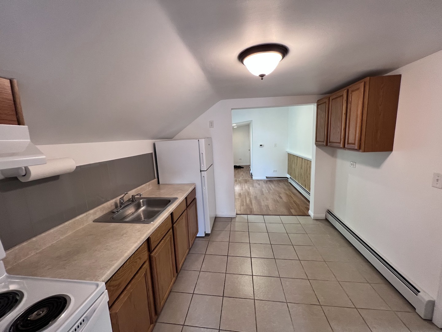 218 South Church Street, Unit 4 Wauconda, IL 60084 - Photo 4 of 11 a kitchen that has a sink and a stove