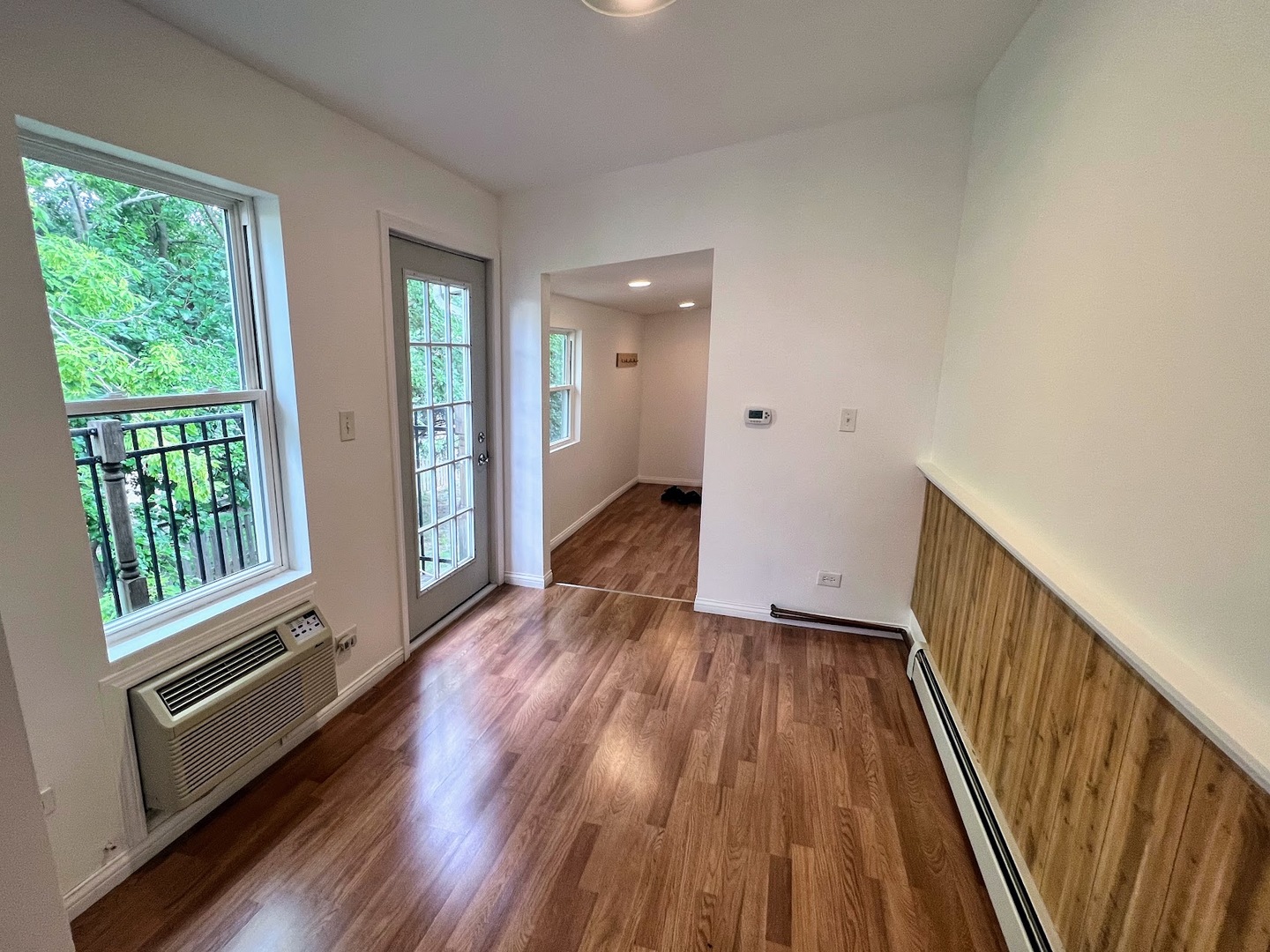 218 South Church Street, Unit 4 Wauconda, IL 60084 - Photo 5 of 11 a view of a hallway with wooden floor and stairs