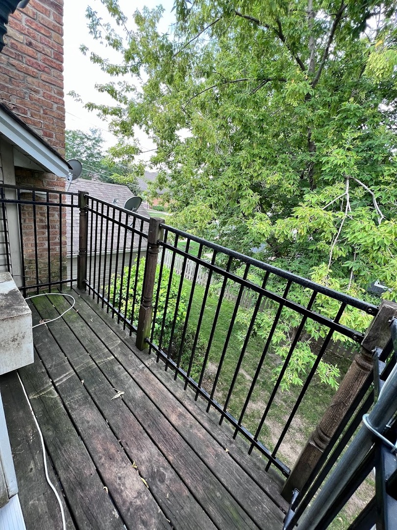 218 South Church Street, Unit 4 Wauconda, IL 60084 - Photo 10 of 11 a view of a balcony with wooden floor