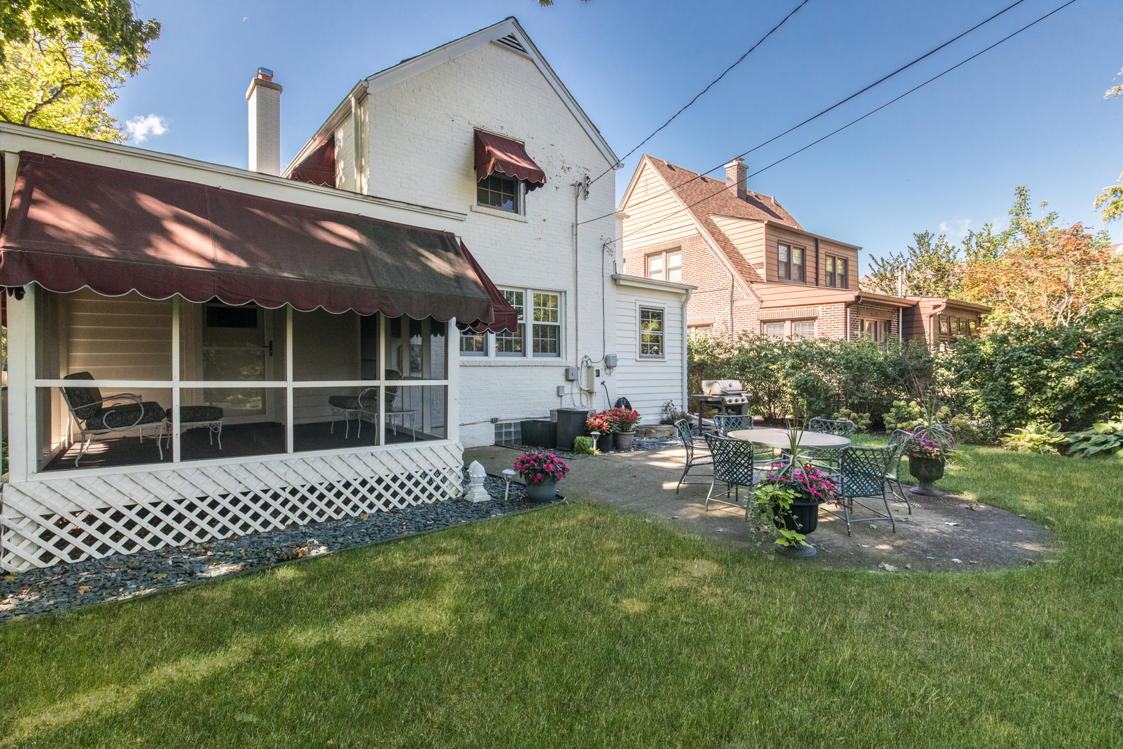 205 North Merrill Street Park Ridge, IL 60068 - Photo 8 of 9 a view of a house with a large window and wooden fence