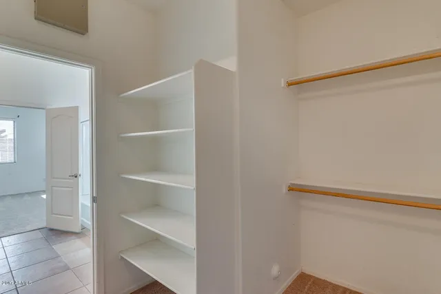 a view of an empty walk in closet