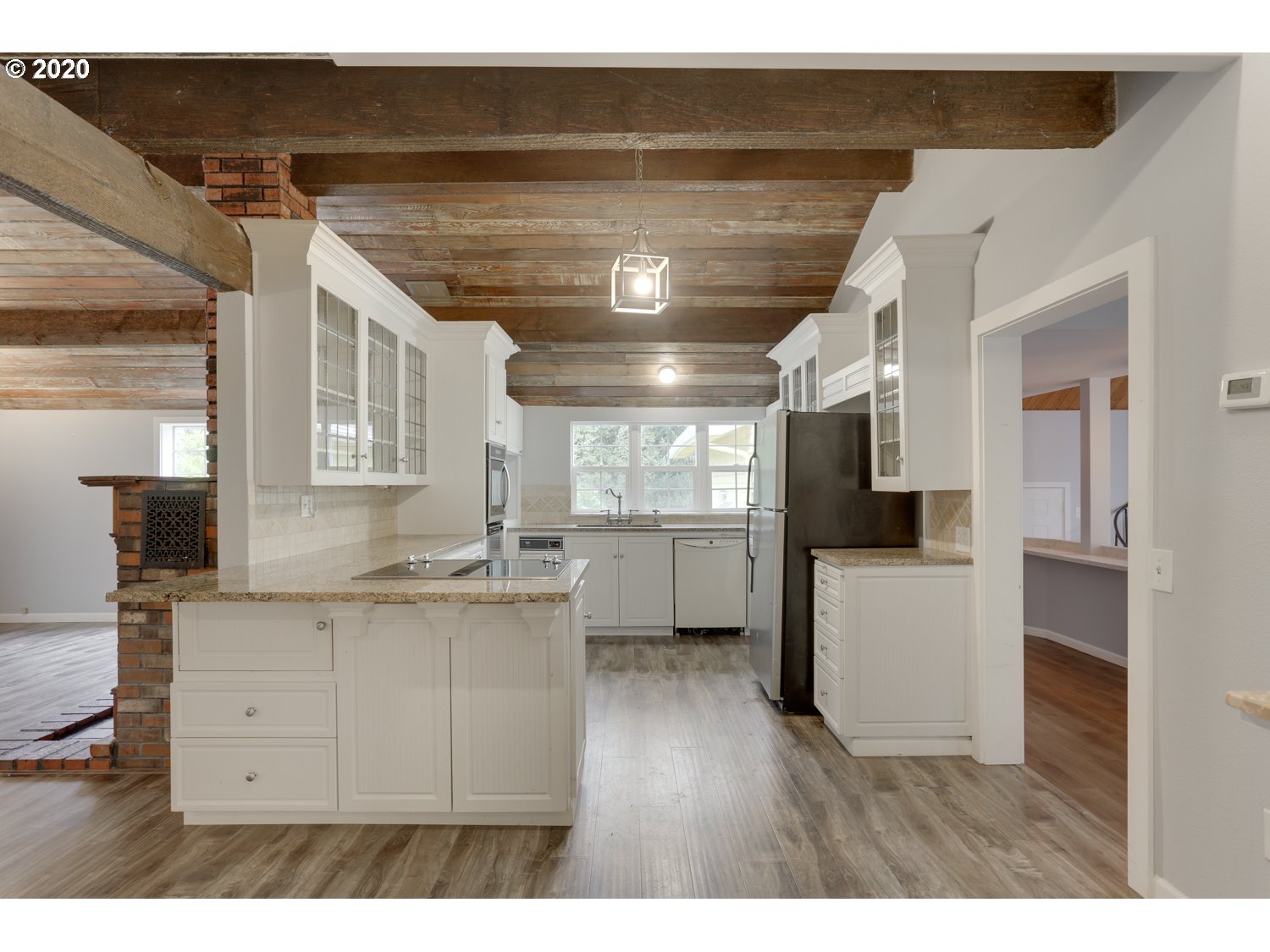 20379 South Ferguson Road Oregon City, OR 97045 - Photo 15 of 32 a kitchen with kitchen island a sink stainless steel appliances and cabinets