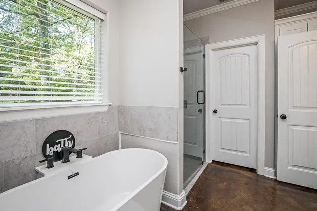 a bathroom with a bathtub and a sink