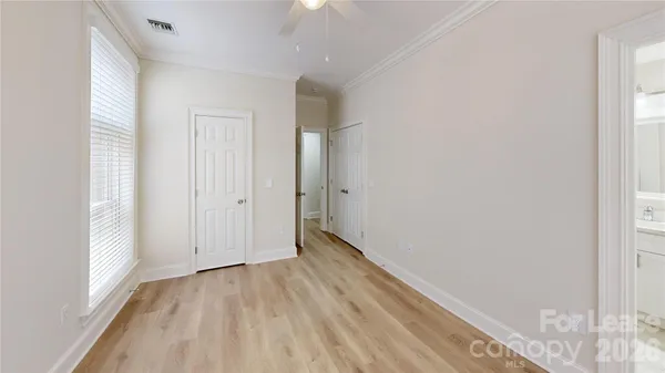 a view of hallway with wooden floor