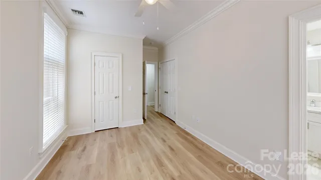 a view of hallway with wooden floor