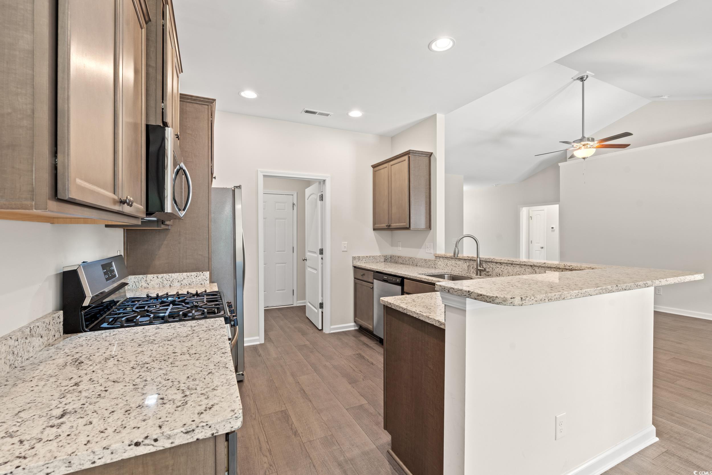 280 Palm Terrace Loop Conway, SC 29526 - Photo 15 of 29 Kitchen featuring kitchen peninsula, light stone c