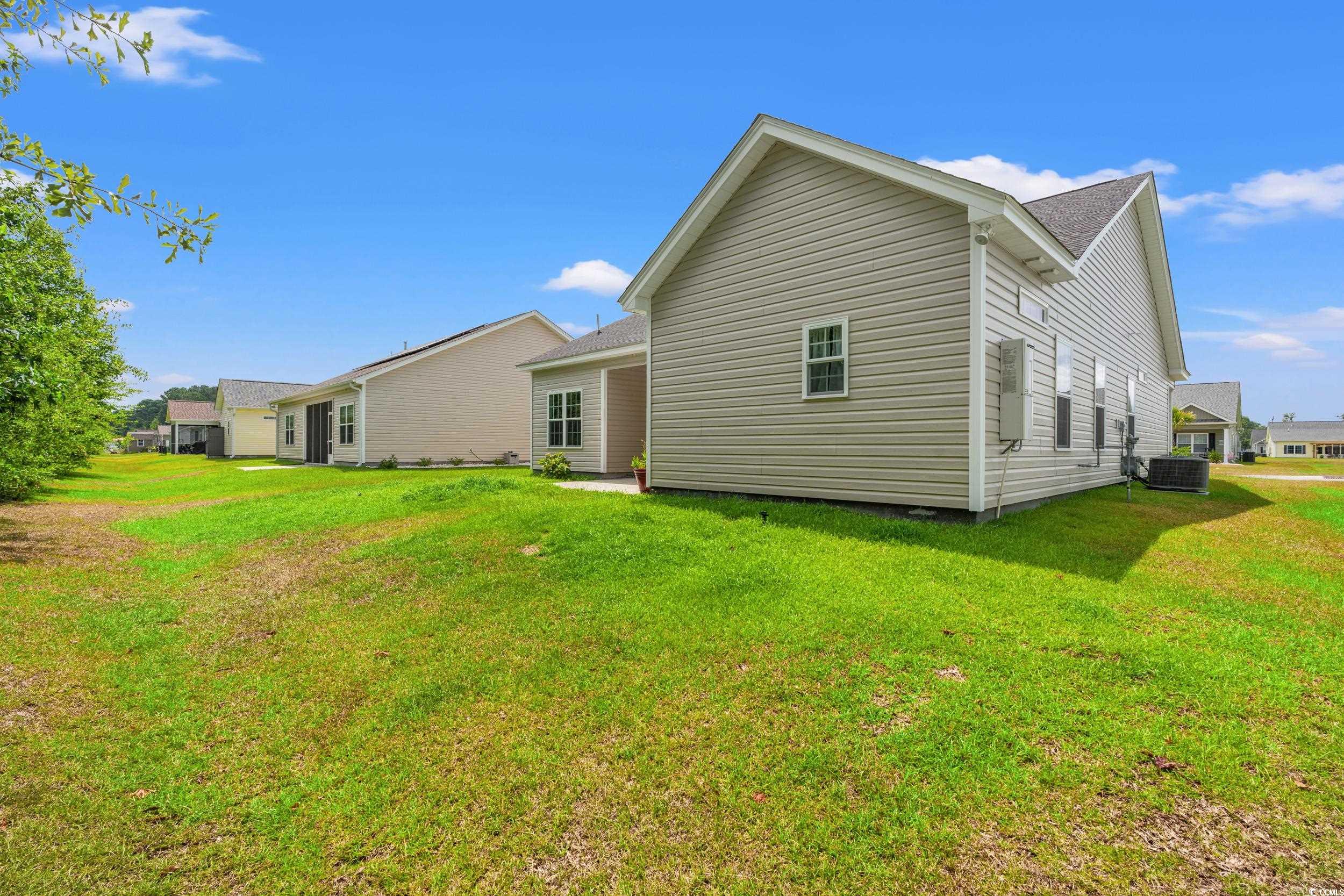 280 Palm Terrace Loop Conway, SC 29526 - Photo 26 of 29 Back of house with central AC and a lawn