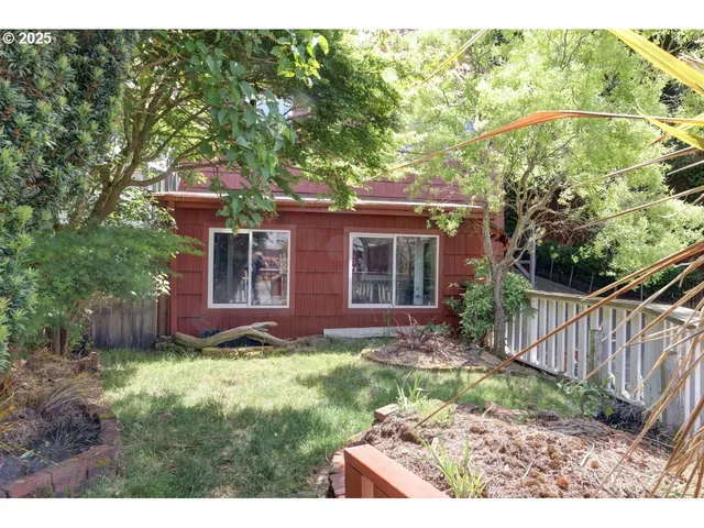 a view of hallway with wooden floor and furniture