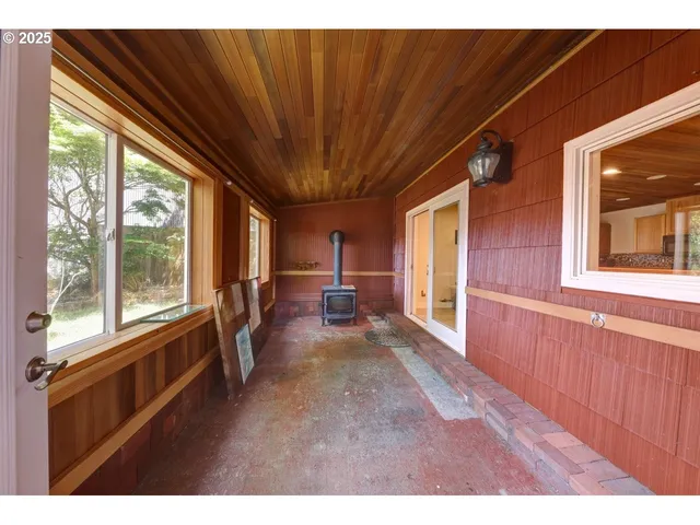 a living room with stainless steel appliances kitchen island granite countertop furniture and a view of kitchen