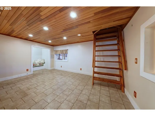 a kitchen with stainless steel appliances granite countertop a refrigerator stove and sink
