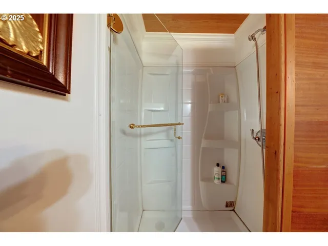 a view of an empty room with a kitchen