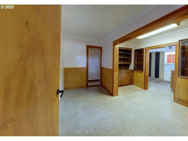 a view of room with window and furniture