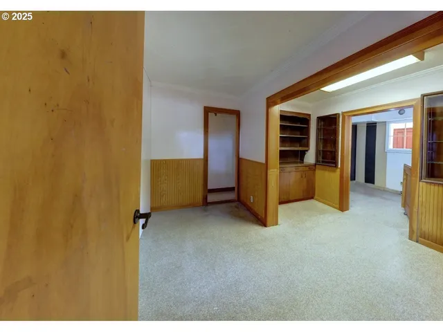 a view of room with window and furniture