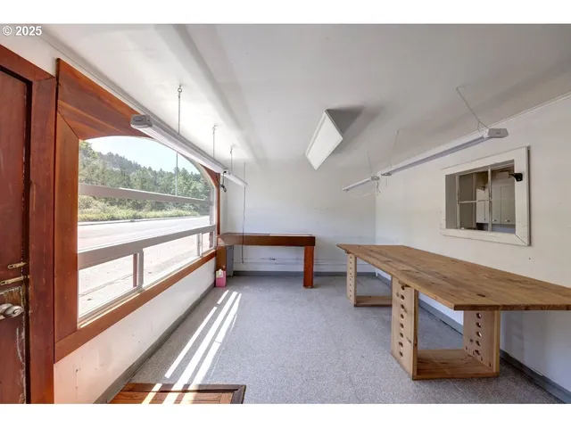 a view of hallway with wooden floor