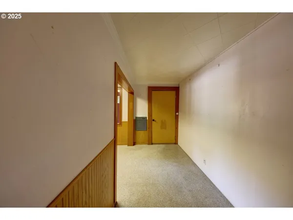 a view of a bathroom from a hallway