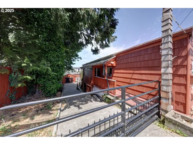 a view of house with a yard