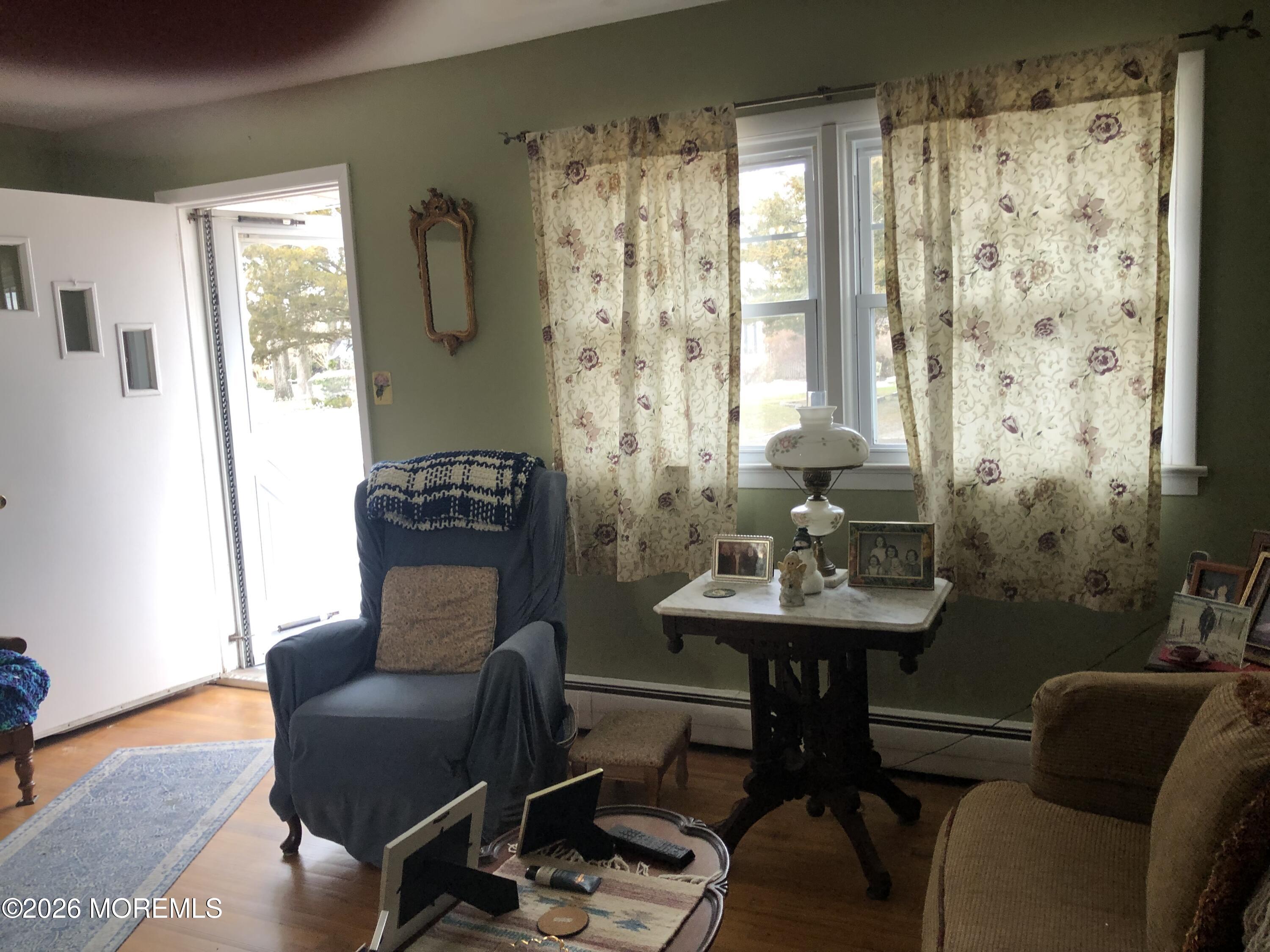 1122 Pine Bluff Avenue Point Pleasant, NJ 08742 - Photo 3 of 10 a view of a livingroom with furniture and a window