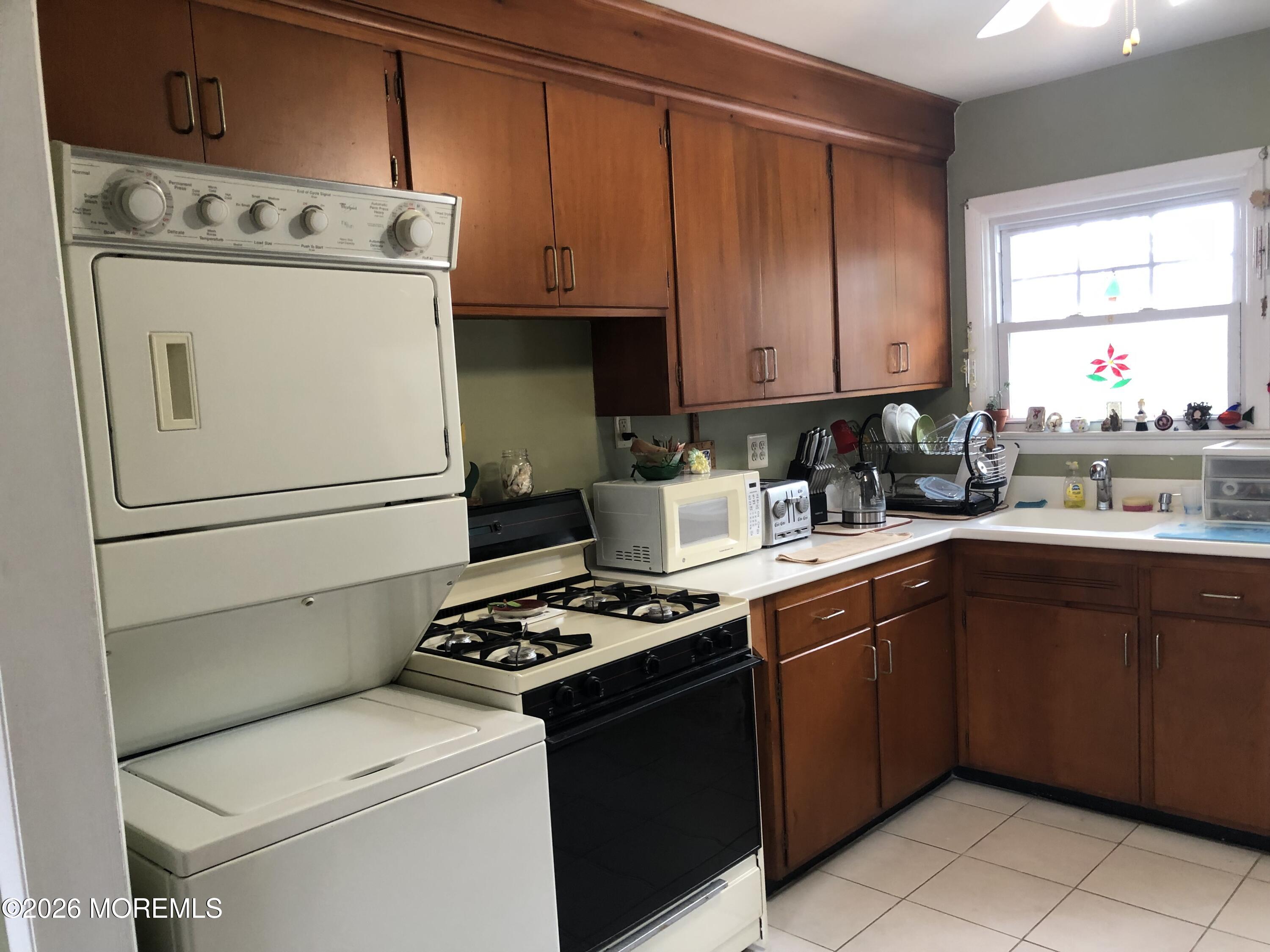 1122 Pine Bluff Avenue Point Pleasant, NJ 08742 - Photo 5 of 10 a kitchen with a cabinets stove and refrigerator